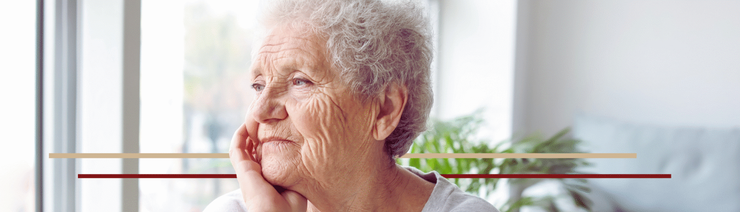 elder woman looking out the window